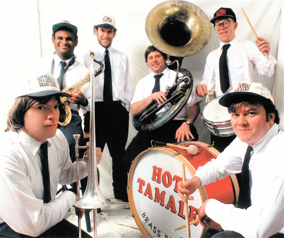 A lively jazz band playing different instruments on stage, creating a vibrant musical atmosphere.