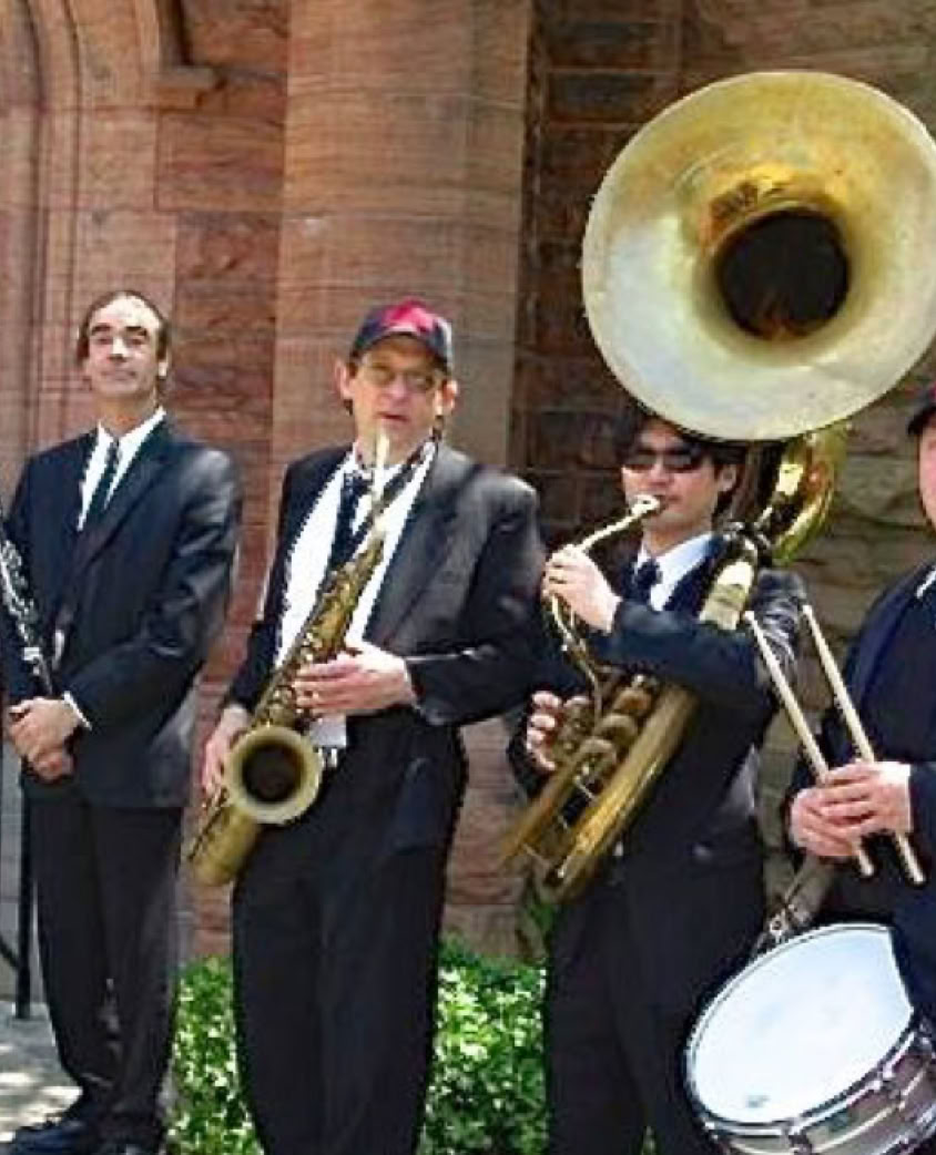 Energetic live music performance featuring a pianist and drummer in a studio setting.