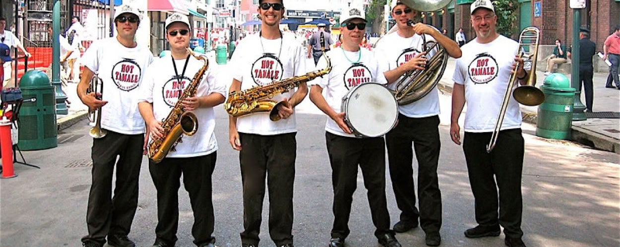 Street musicians playing saxophone, trumpet, and banjo in a classic jazz ensemble.